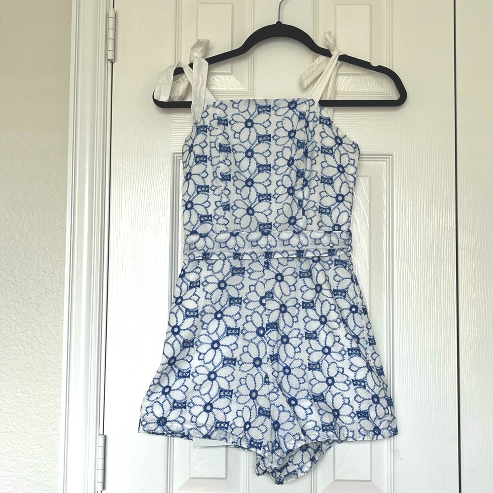 White romper with blue embroidered flowers. Bought at Francesca‘s, size xxs